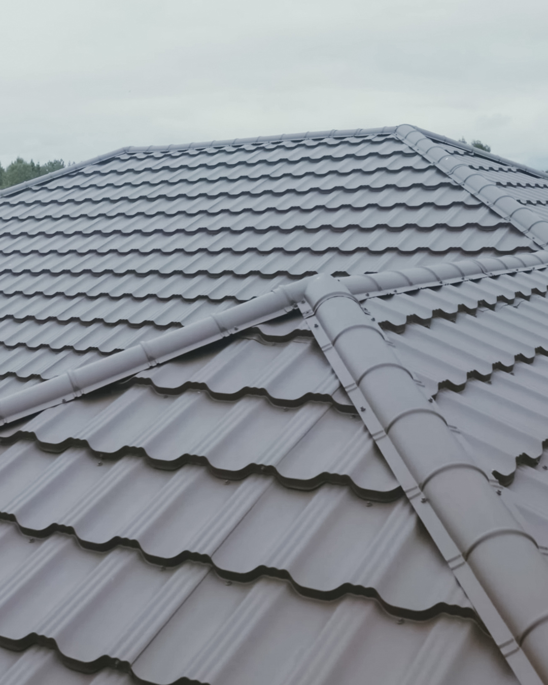 Striking photo of a modern, architectural metal roofing system installed on a residential or commercial property