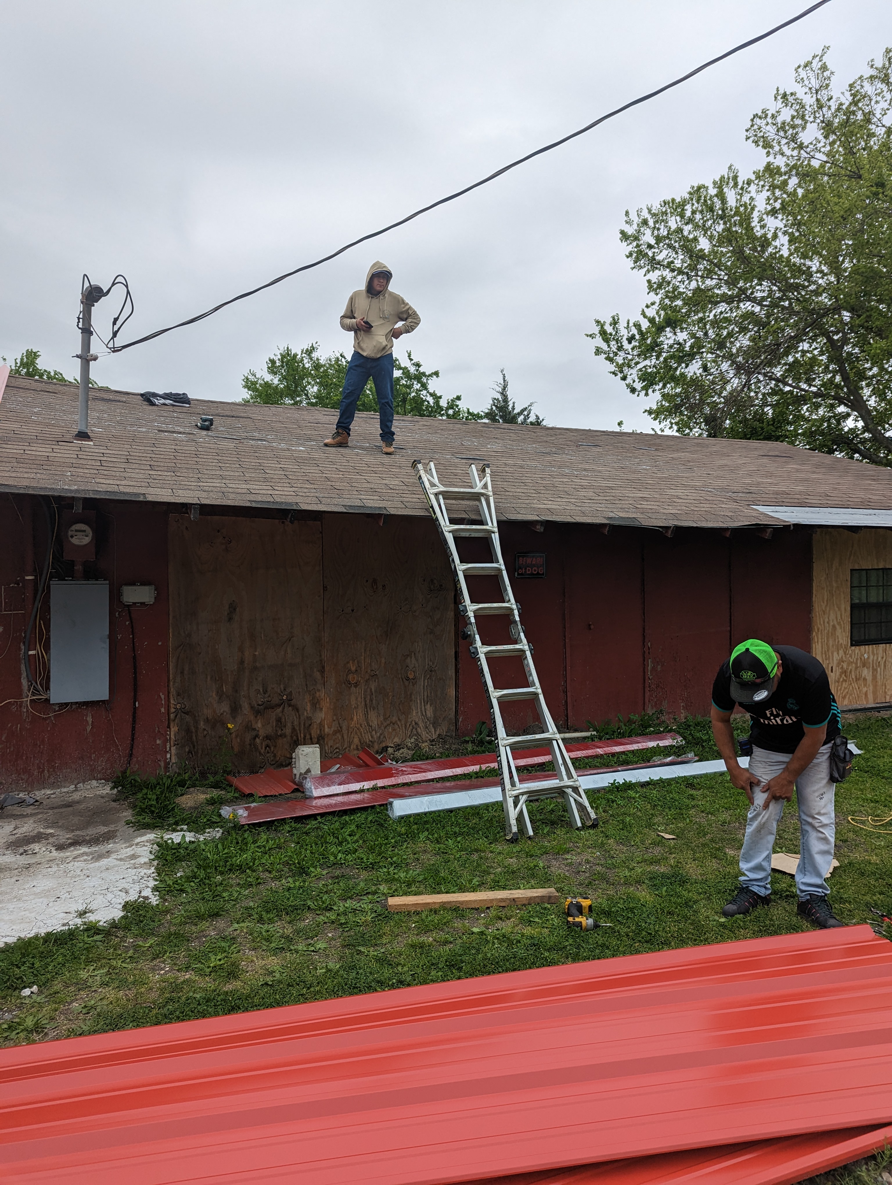Custom metal panel installation on a residential roof in Frisco TX