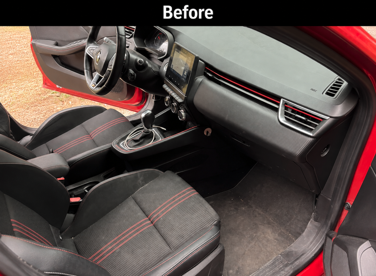 Red car interior cockpit and passenger side dash before detailing in Savannah