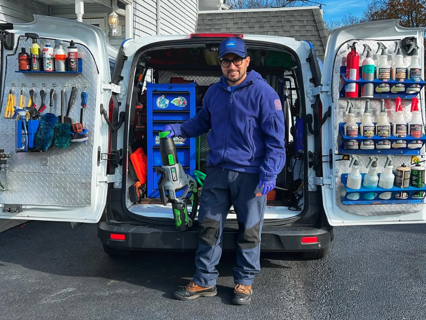 Mobile detailing professional with an organized detailing van.