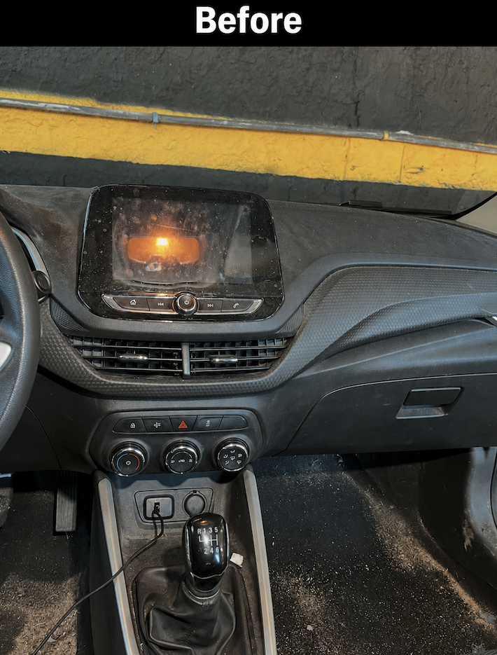 Dusty center console, screen, and gear shift before mobile detailing in Savannah