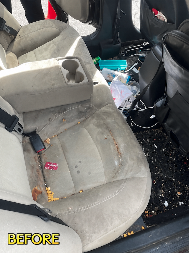 Soiled rear seating area with food crumbs and trash before interior detailing in Savannah
