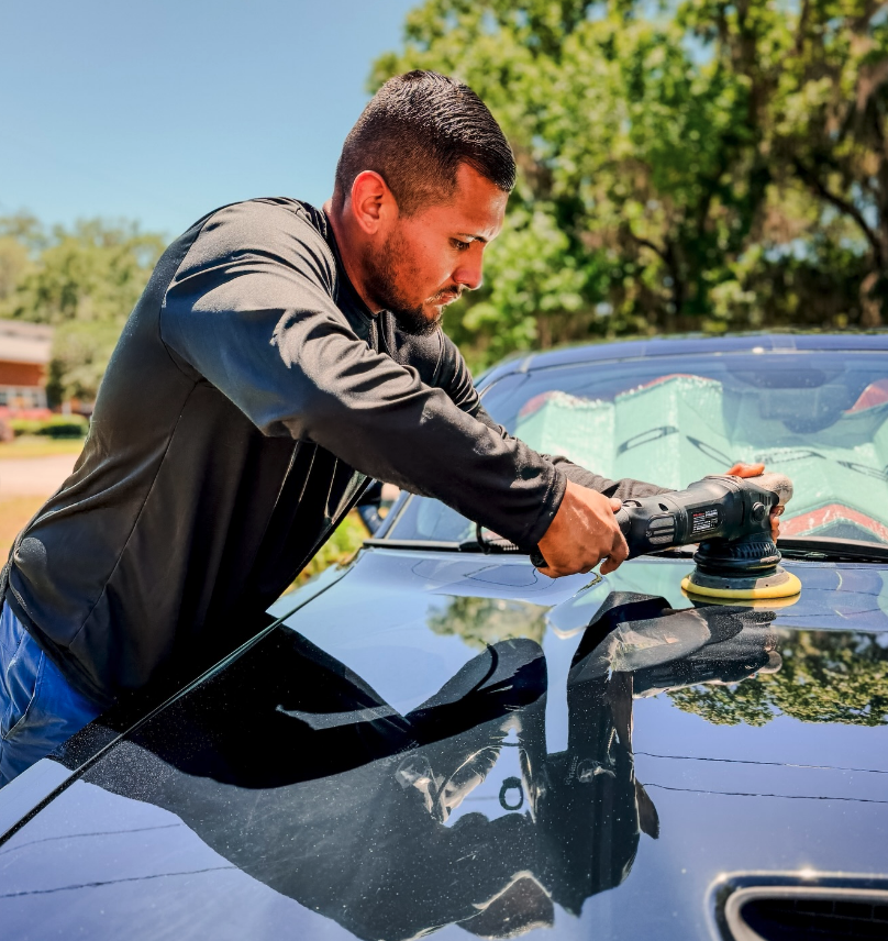 Mobile detailer polishing a vehicle in Savannah.