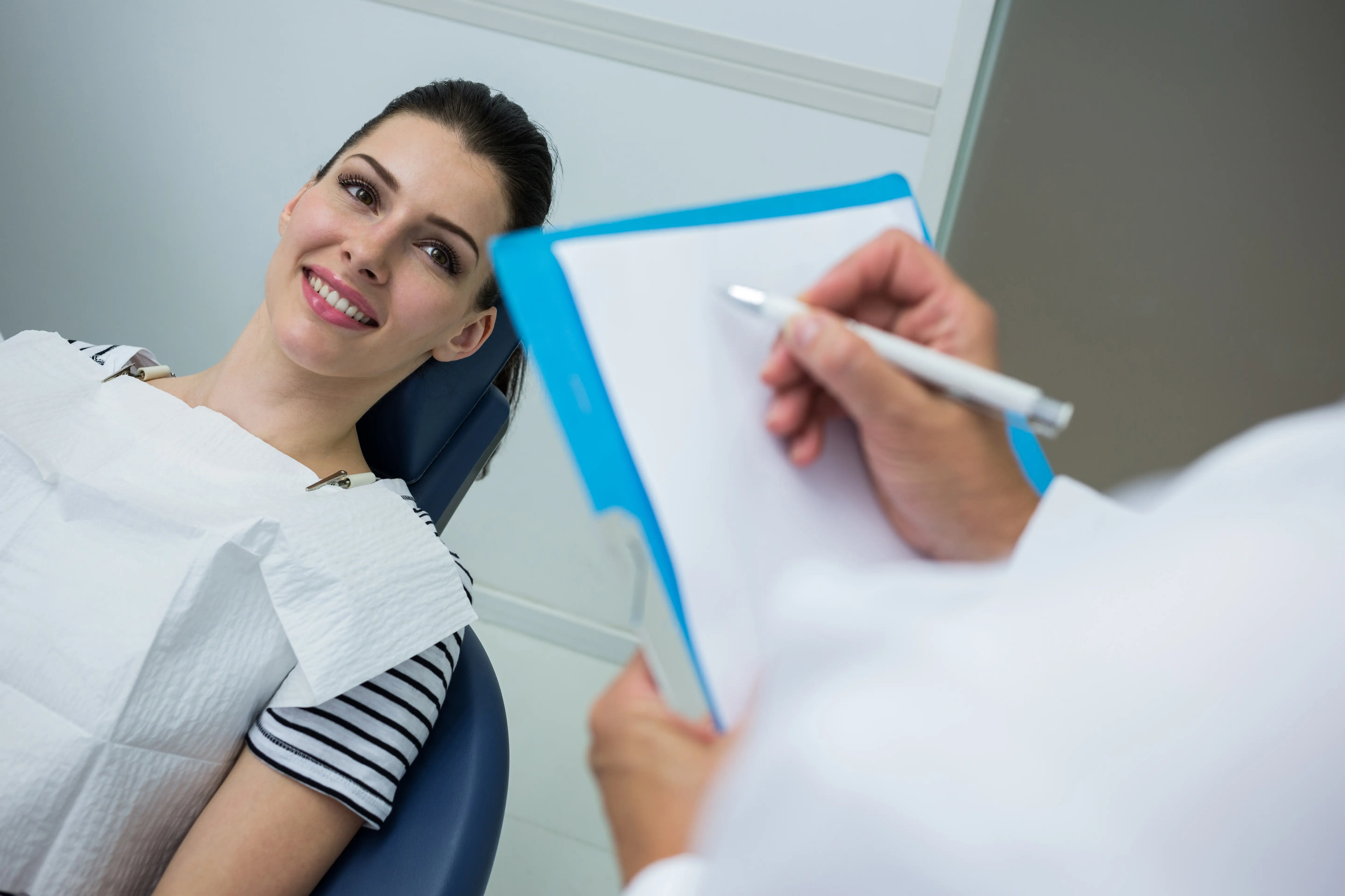 Patient assessment and oral surgery consultation with dentist