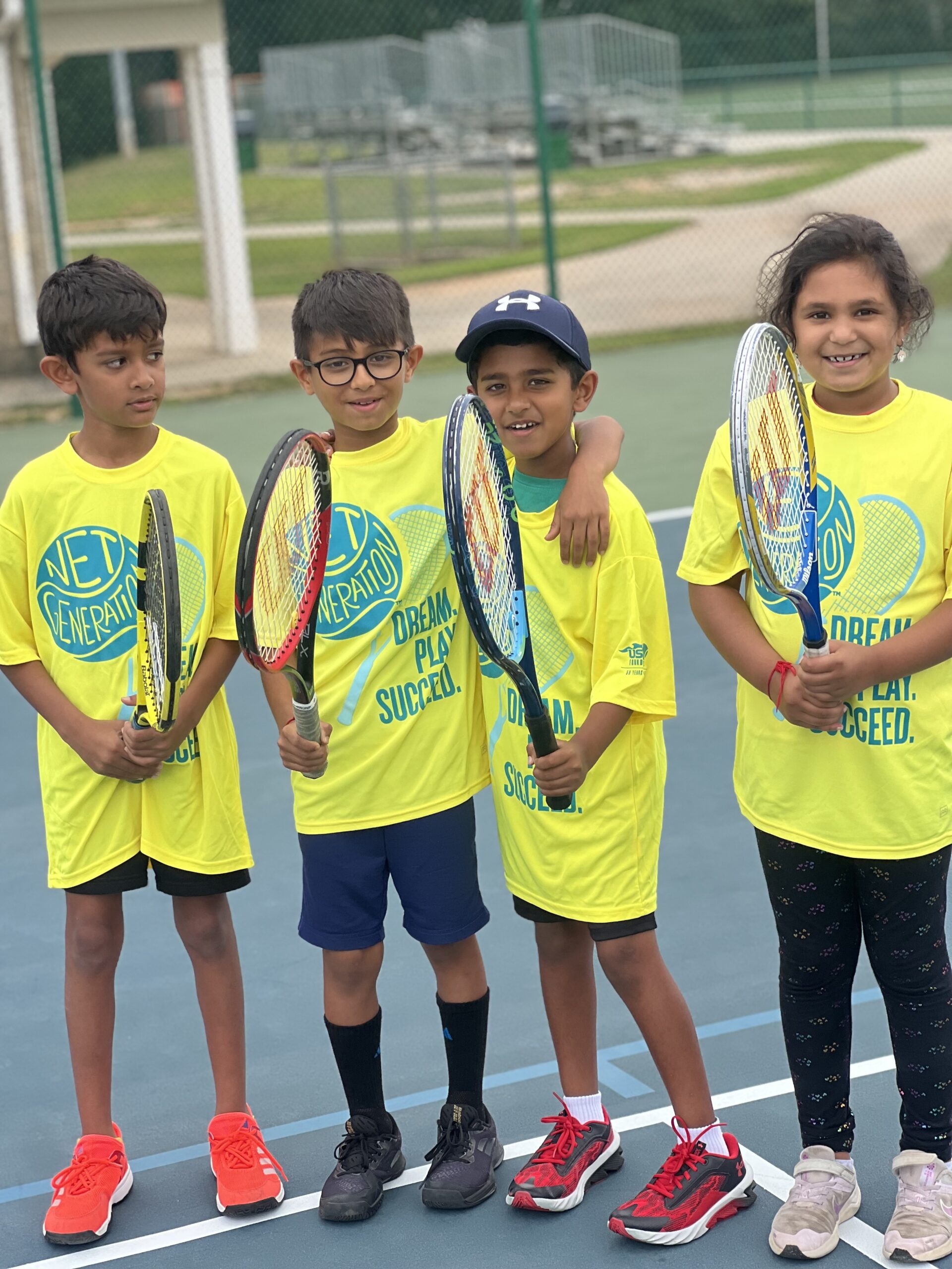 Children participating in a Simunyola junior tennis lesson