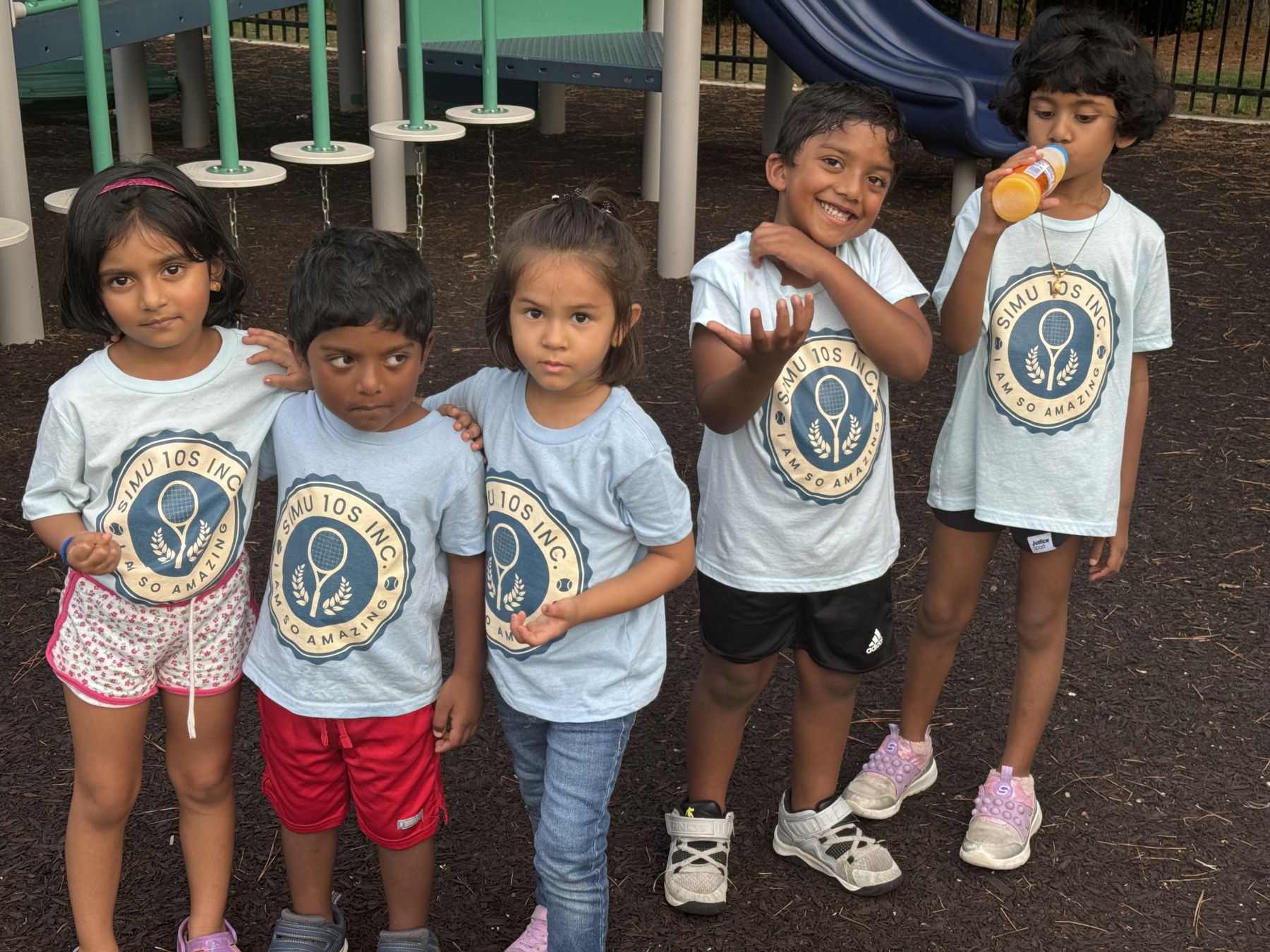 Group of young Simu 10s players together at the playground