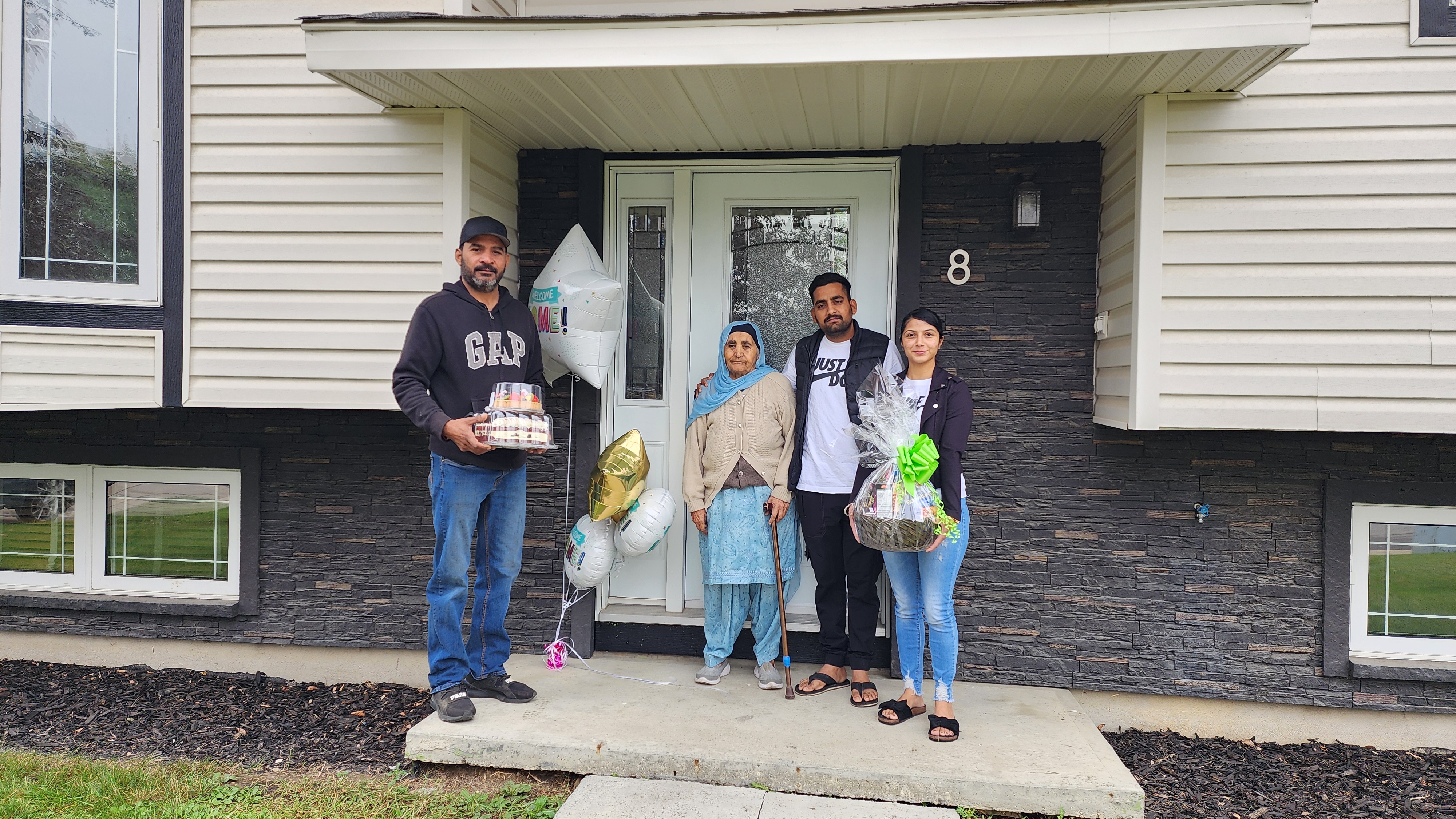 New home milestone: Celebrating closing day on the front steps in Fort McMurray