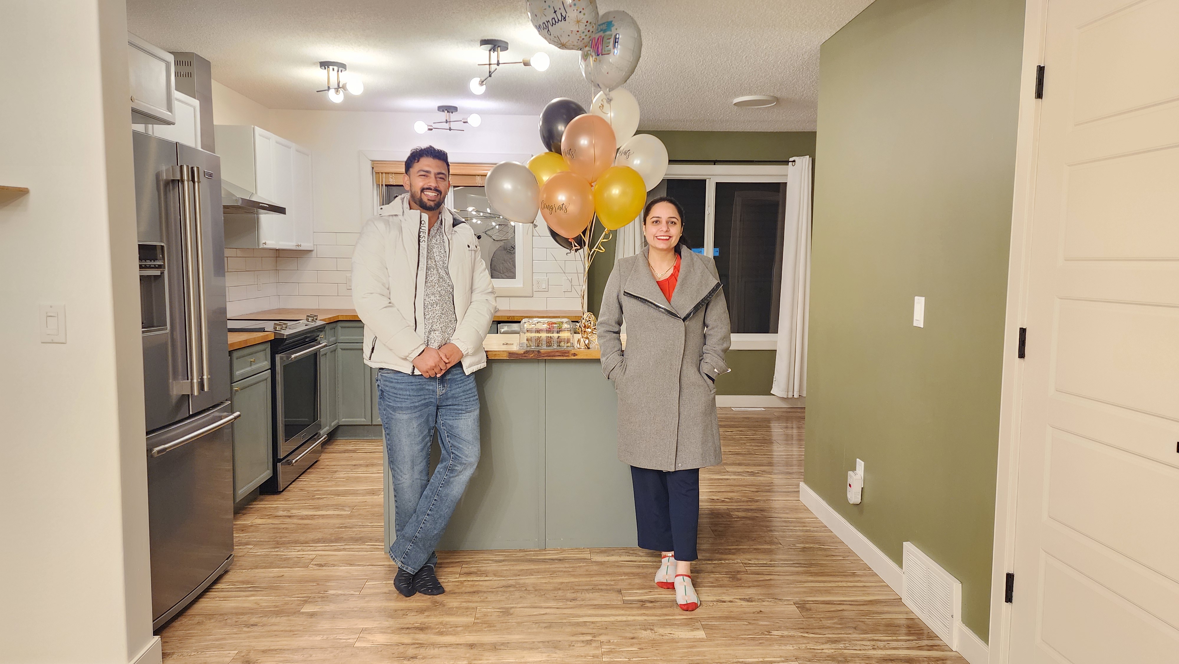 Keys in hand: Proud homeowners in their renovated Fort McMurray home