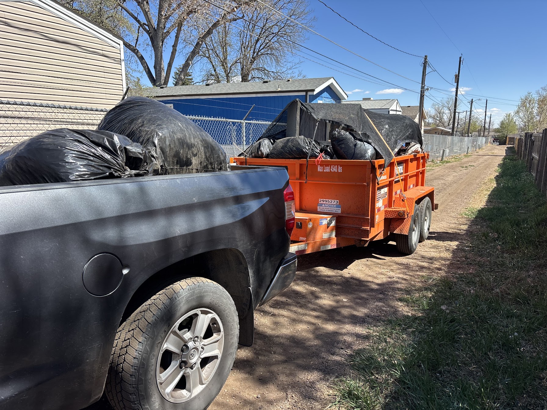Milton's Junk Removal truck hauling junk in Greeley, Colorado