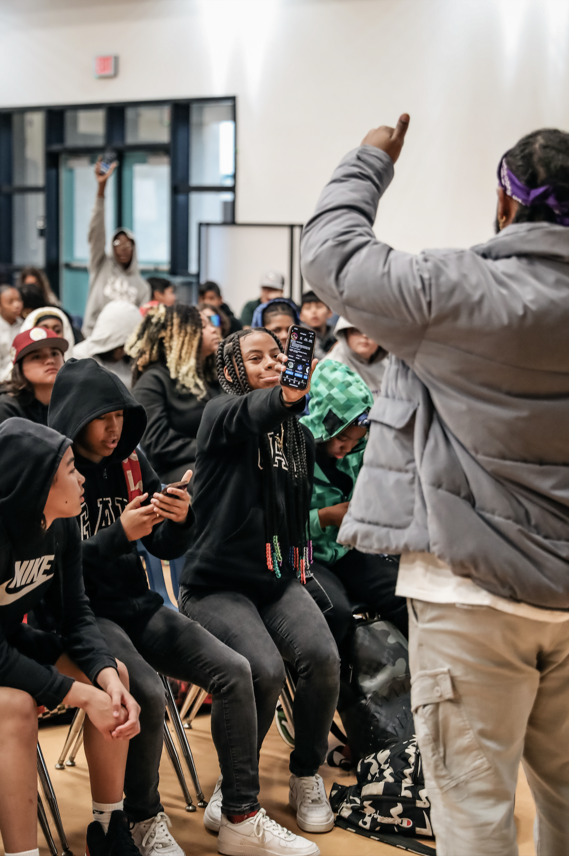 Oliver J. North speaking with students in classroom assembly