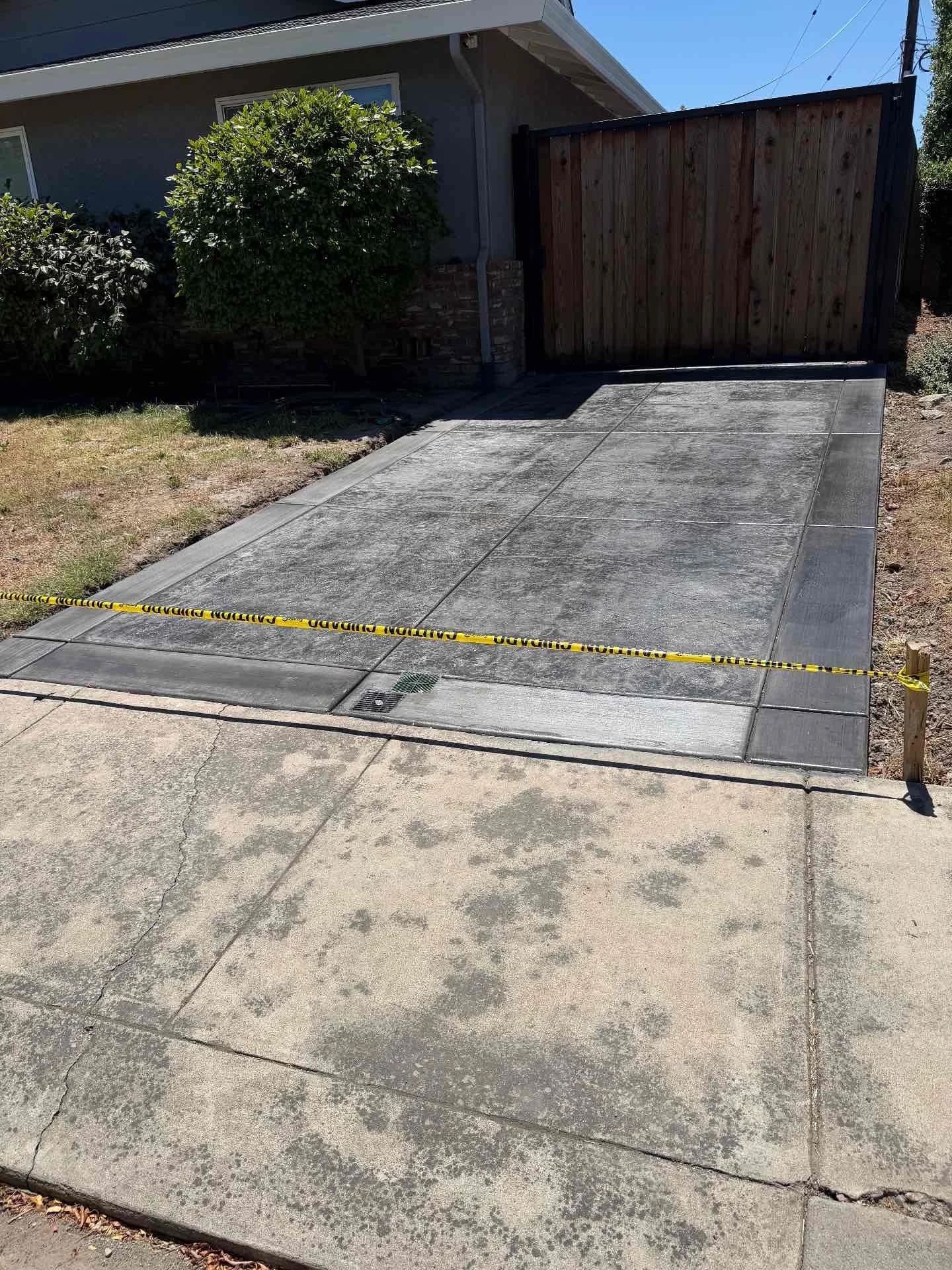 Decorative stamped concrete driveway with clean bordered edges