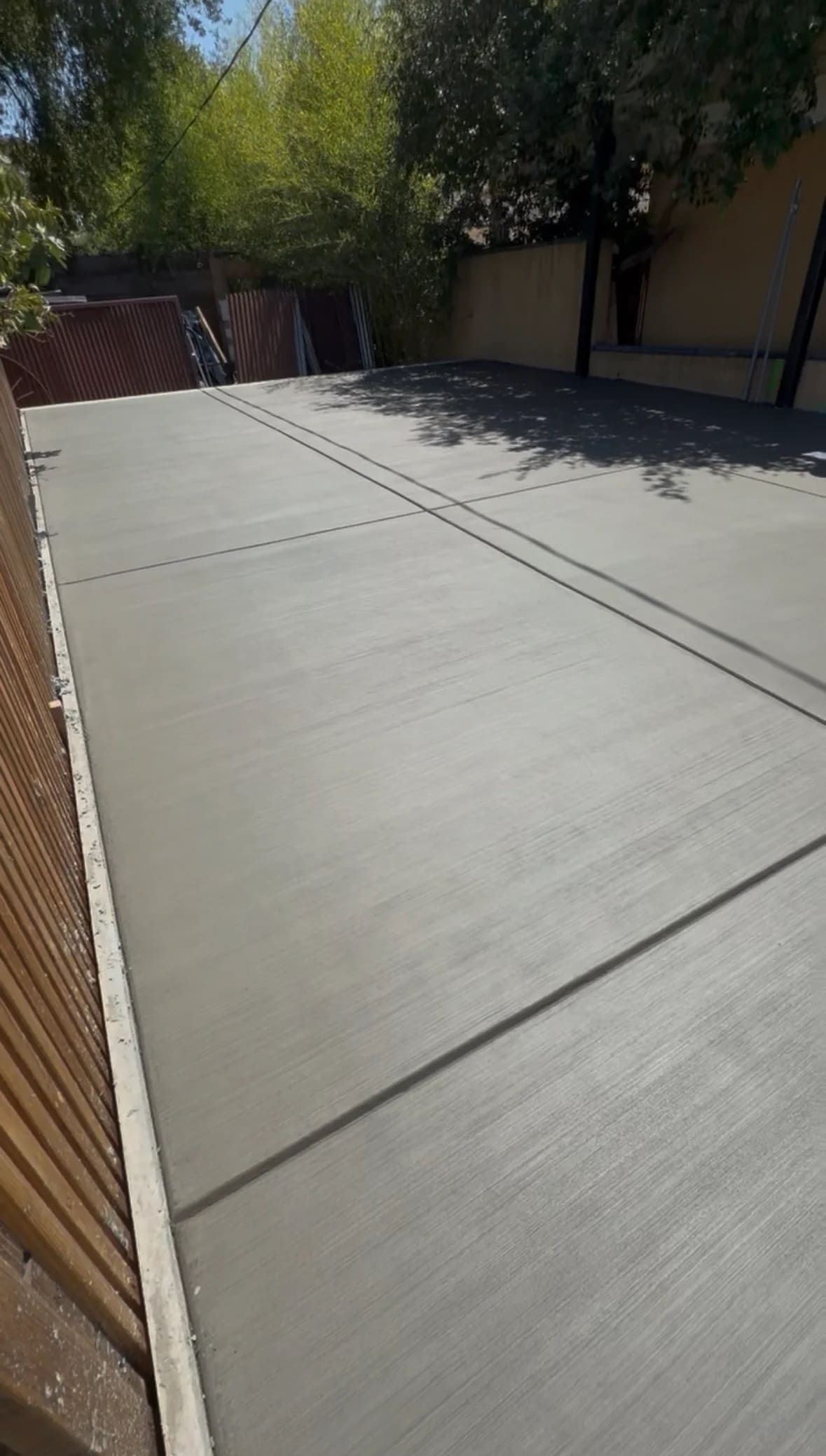 Broom-finished residential concrete flatwork and side driveway