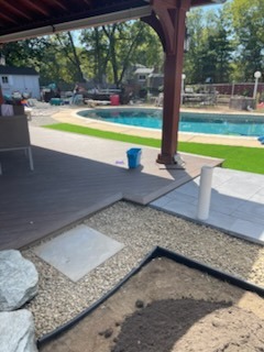 Covered Deck Patio & River Rock Accent Walkway