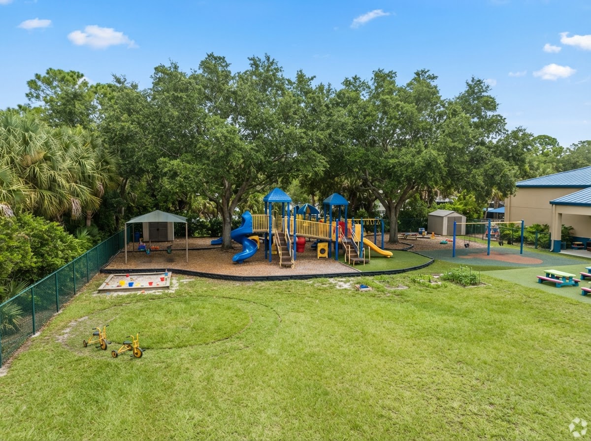 The spacious outdoor playground at Jelly Bean Junction where children play and explore