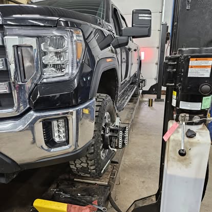 Commercial fleet truck on the lift at Ehrmentraut Auto Repair