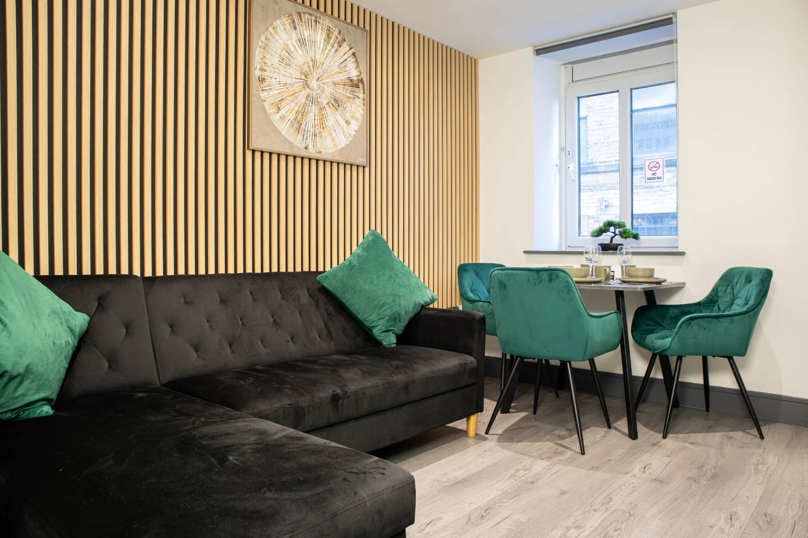A bright, spacious serviced apartment lounge and dining area in a West Yorkshire property