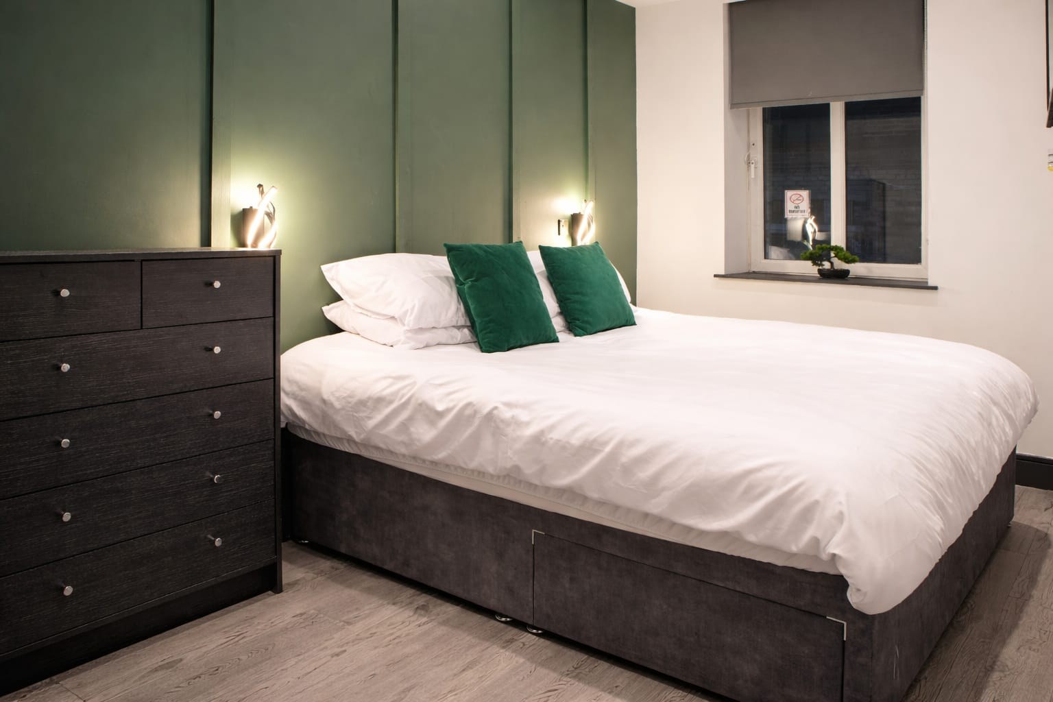 Alexander 14 — bedroom with super king bed and green panelled feature wall