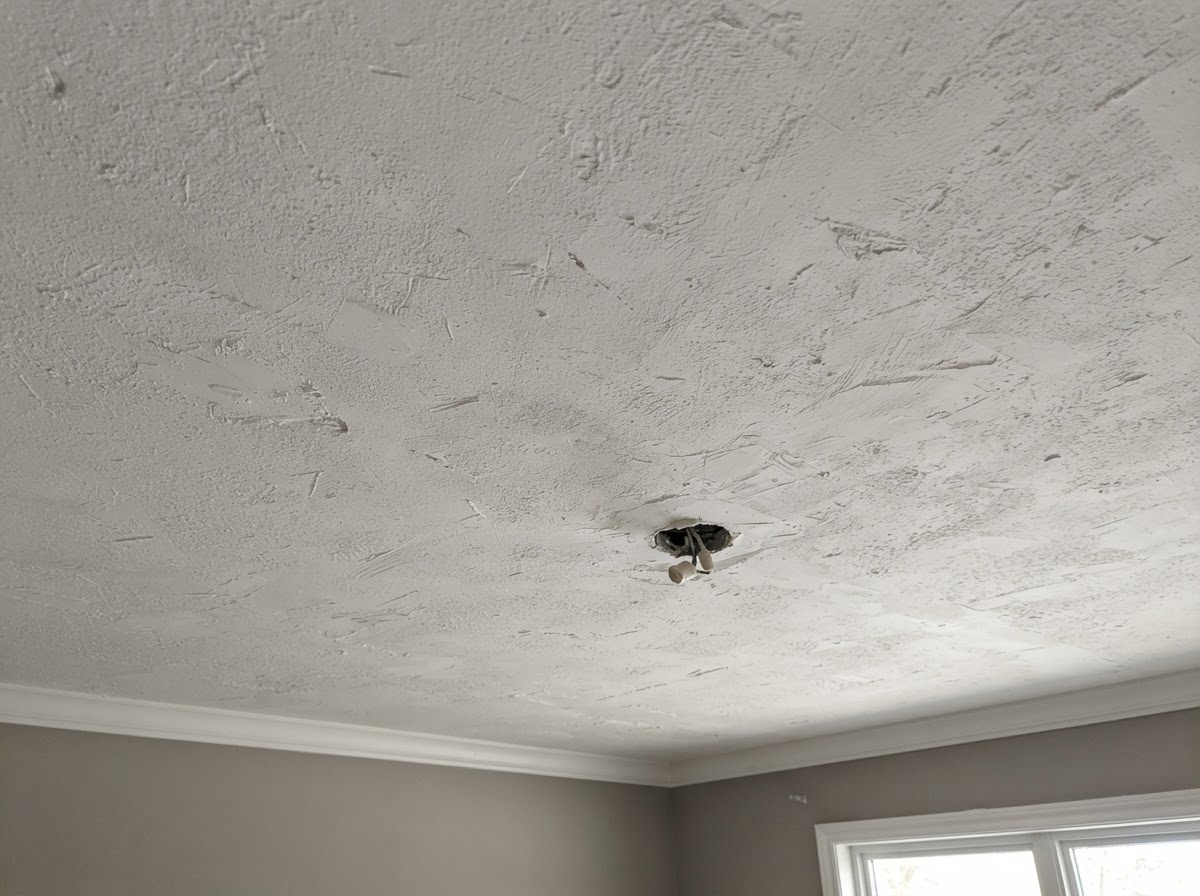 Ceiling prepared for refinishing after popcorn texture removal