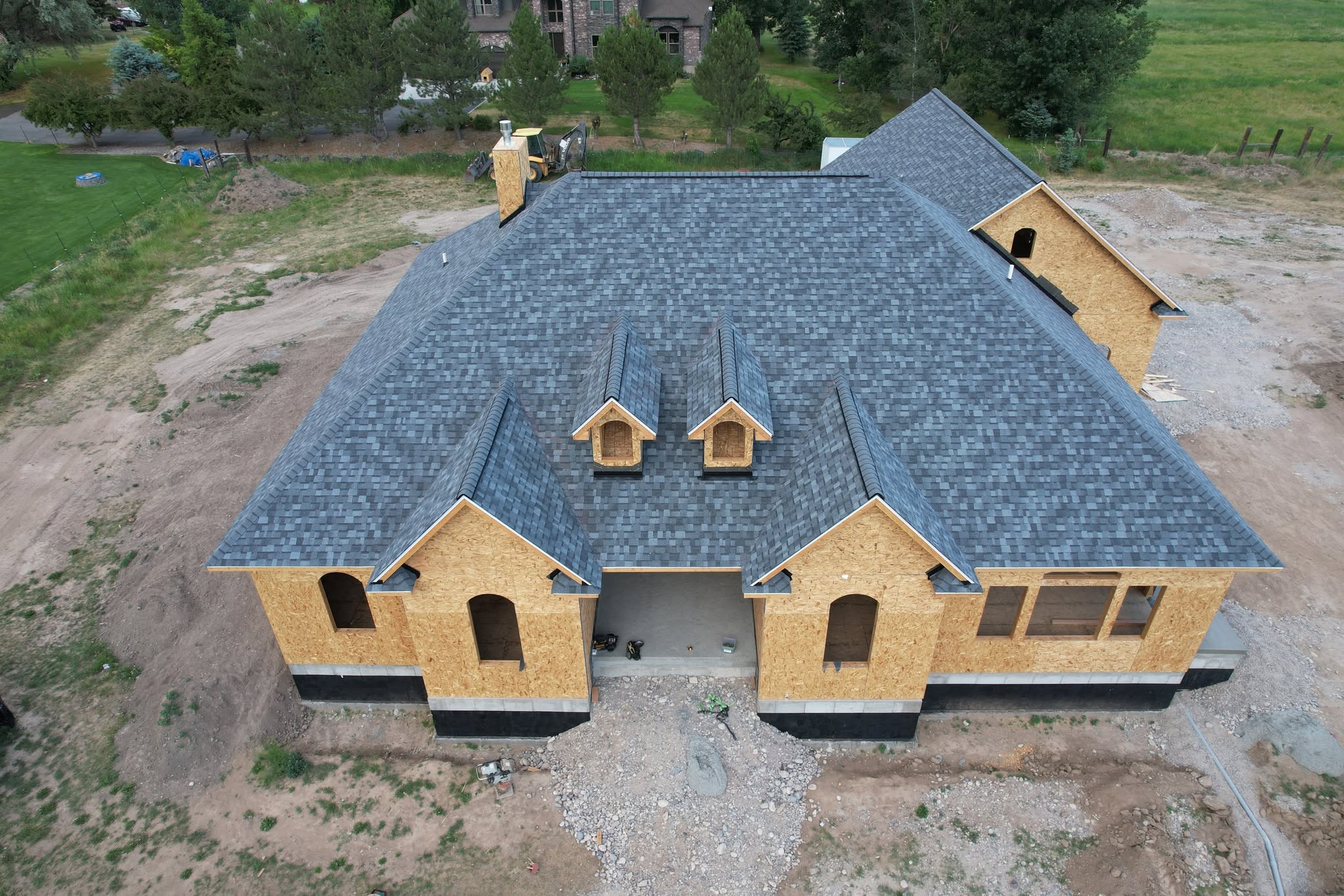 Roofing project with crane staging materials