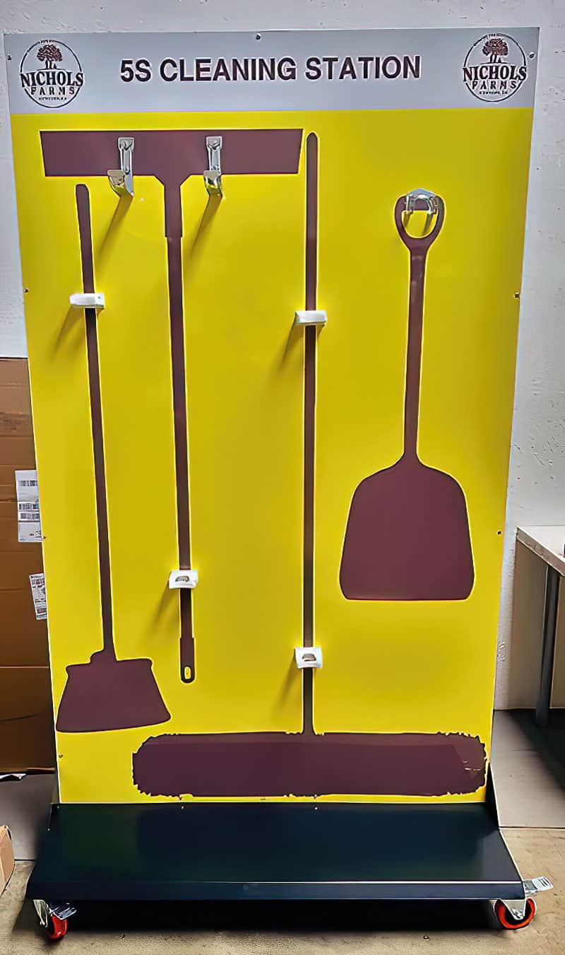 Nichols Farms 5S Cleaning Station mobile cart with locking casters, high-contrast yellow backing, squeegee, brooms, and scoop shovel
