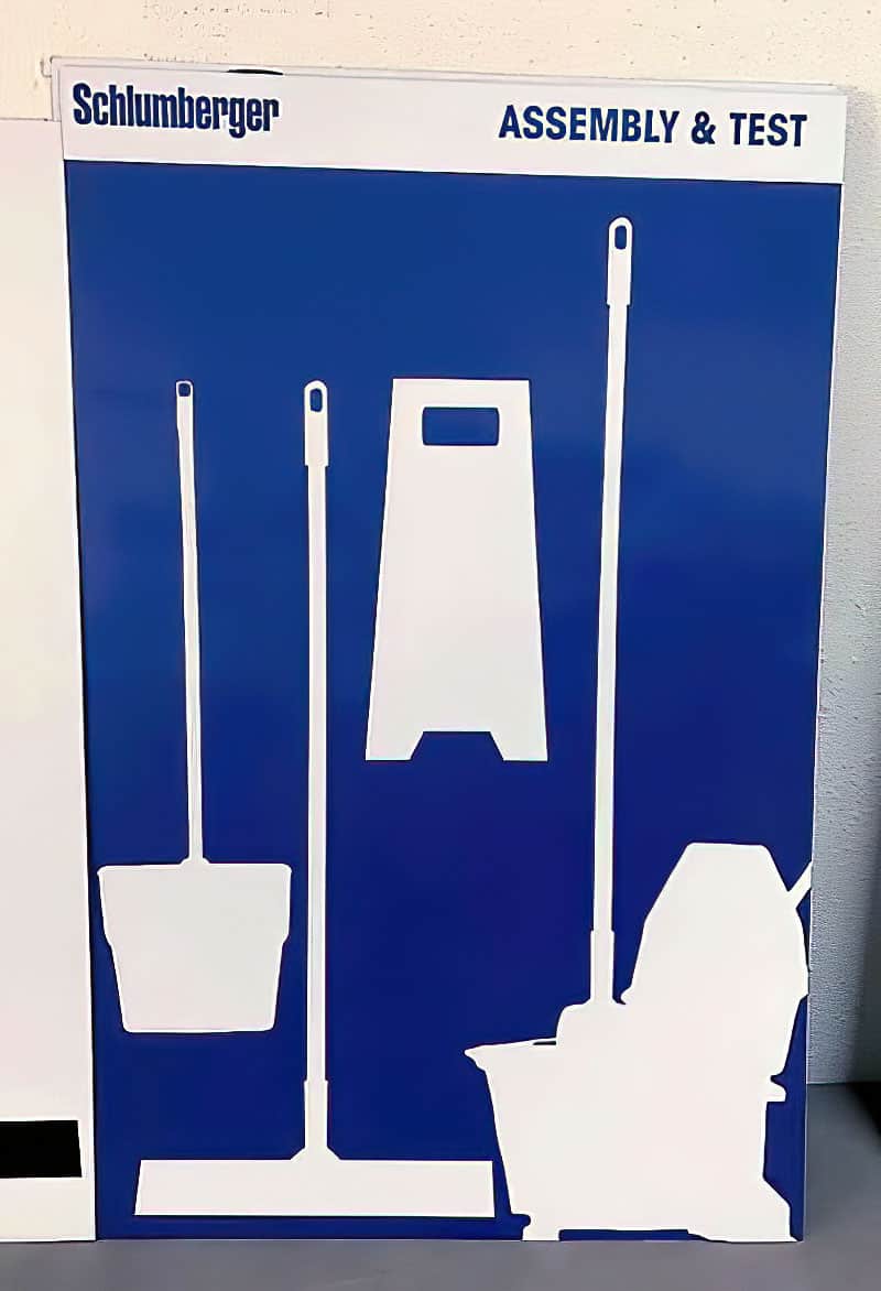 Schlumberger Assembly and Test cleaning tool shadow board with mop bucket, dustpan, and floor sign silhouettes