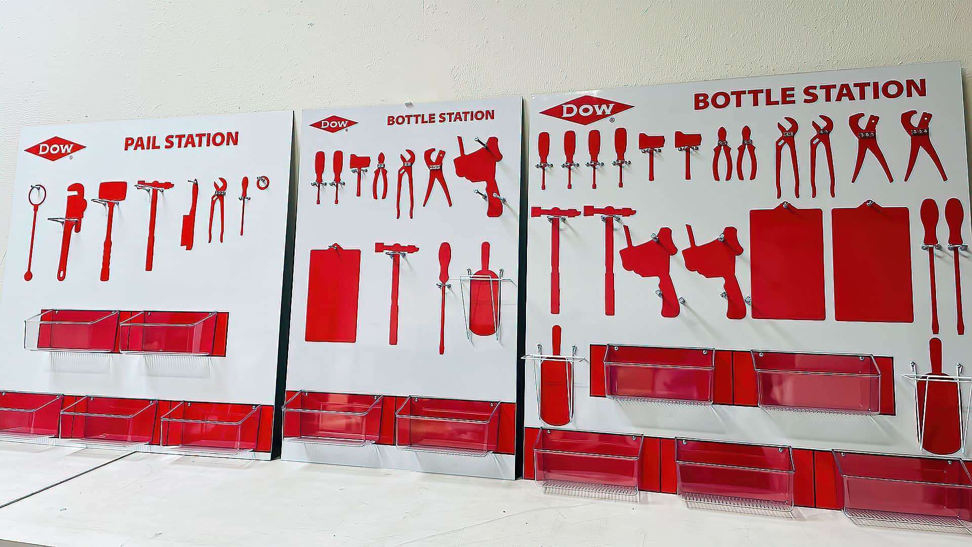 Dow Chemical Pail Station and Bottle Station large multi-panel tool shadow board system with red silhouettes, tool clips, clipboards, and heavy-duty wire storage caddies