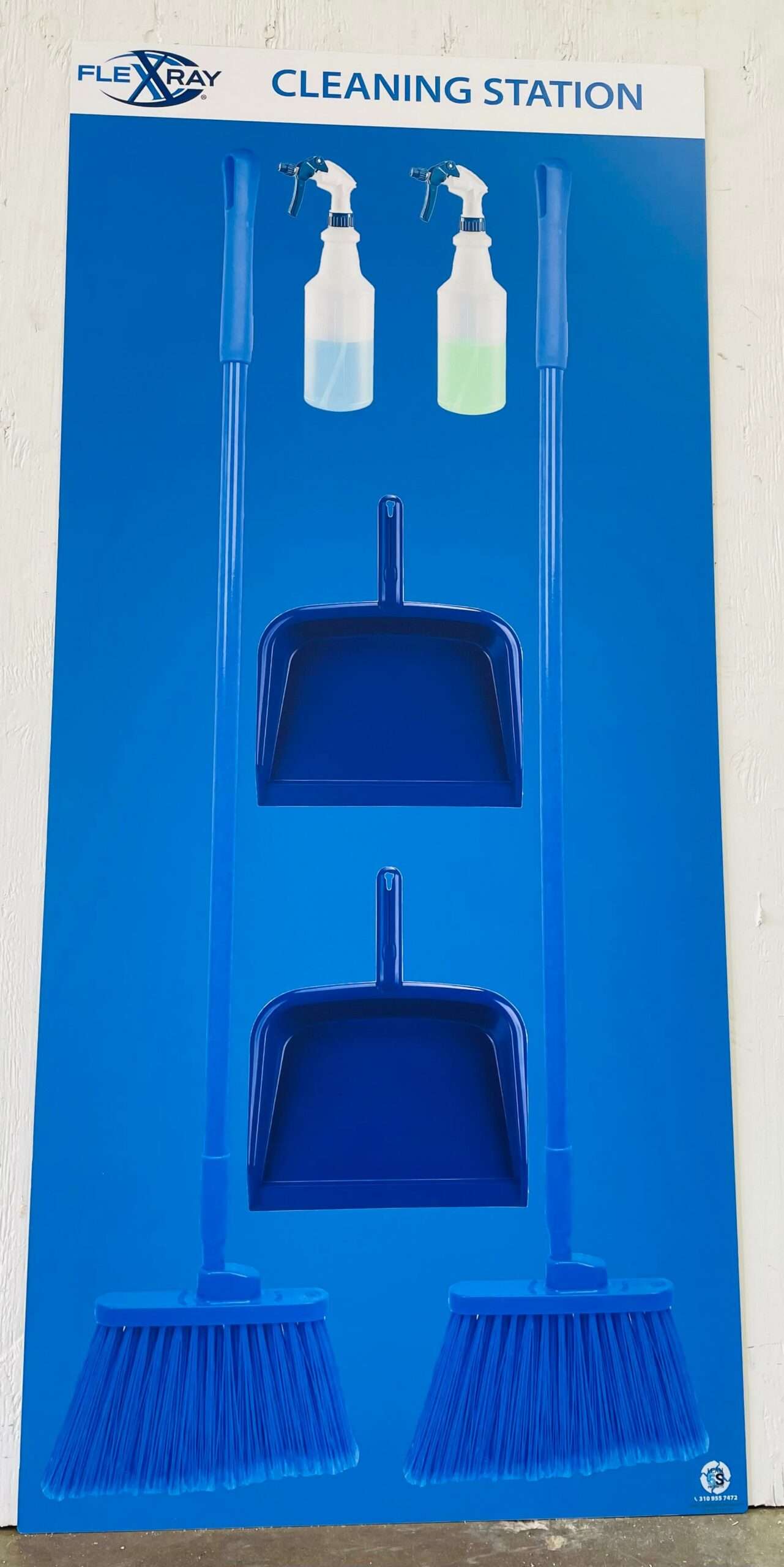 FlexXray Cleaning Station solid blue shadow board with dual spray bottles, twin angle brooms, and handheld dustpans