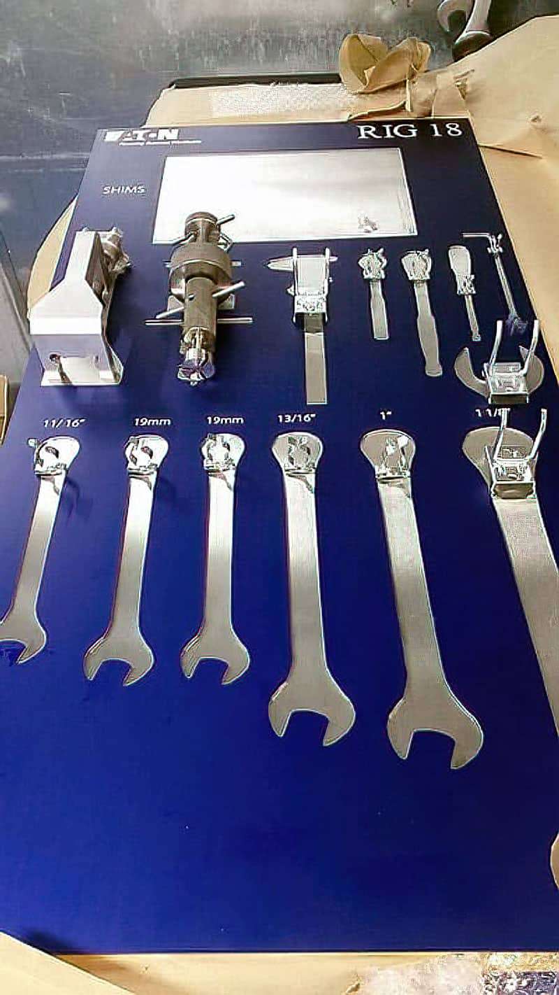 Eaton Rig 18 precision maintenance tool shadow board in royal blue with shims storage pocket, calibrated micrometer calipers, and exact-size labeled wrenches