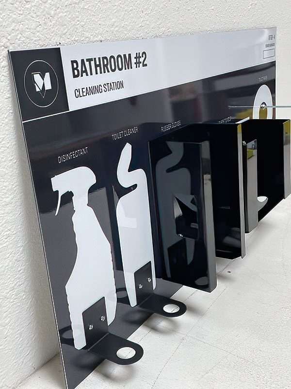 Facility Bathroom 2 Cleaning Station shadow board in gloss black composite with custom powder-coated bottle brackets and glove dispensers