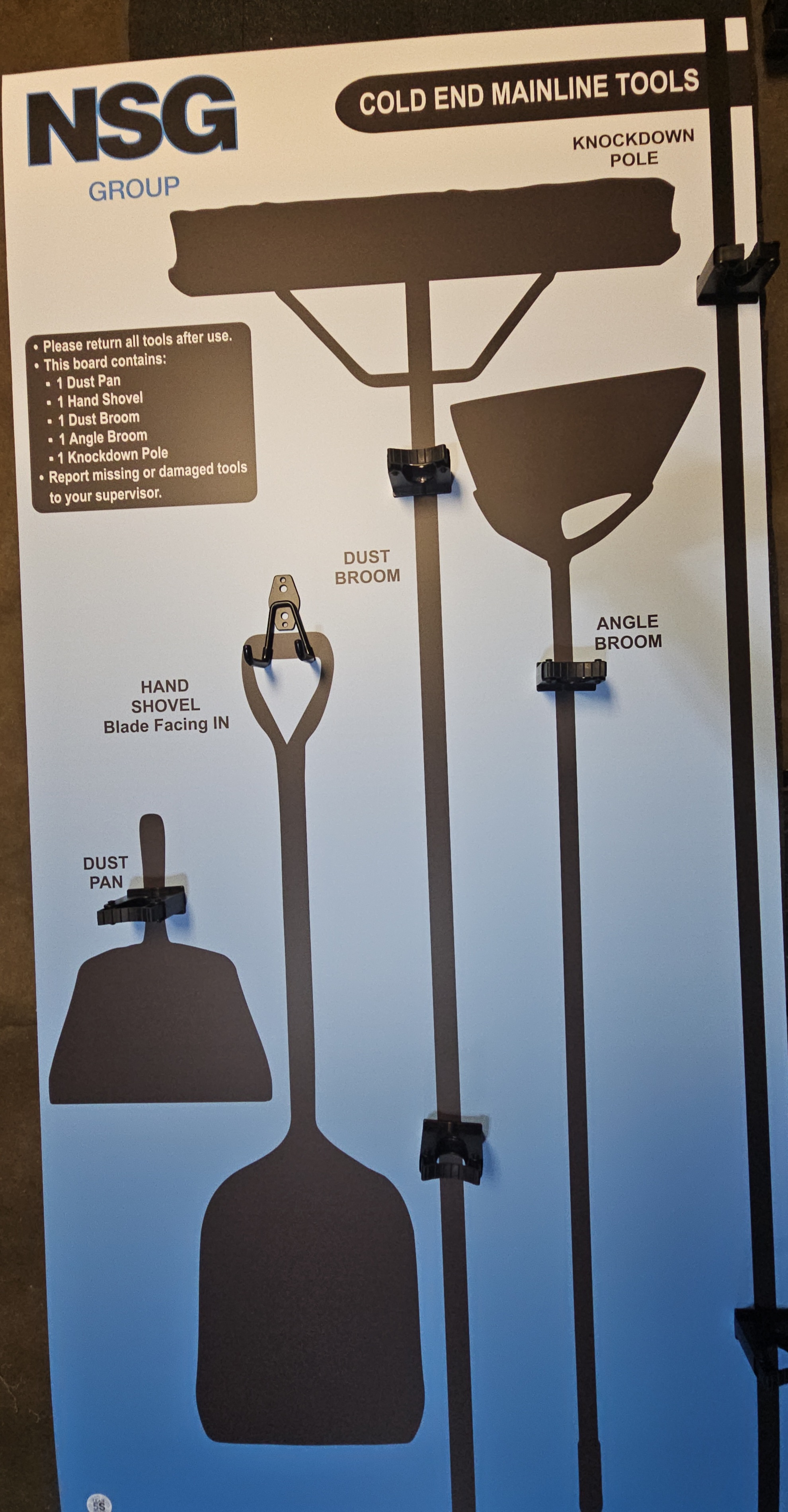 NSG Group Cold End Mainline Tools custom shadow board with black silhouettes and mechanical spring clamps for knockdown pole, dust broom, hand shovel, angle broom, and dustpan