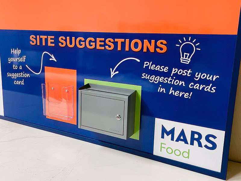 Mars Food Site Suggestions continuous improvement board with suggestion card holder pocket, lockable steel ballot box, and corporate branding