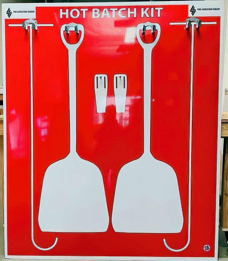 The Carlstar Group Hot Batch Kit high-visibility red shadow board with white silhouettes and hanging brackets for mixing paddles, scraper hooks, and scrapers