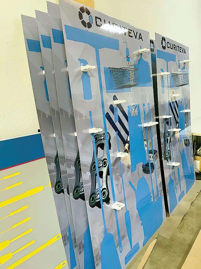 Curiteva medical device facility batch production run of branded 5S cleaning stations with wire baskets and precision tool shadows