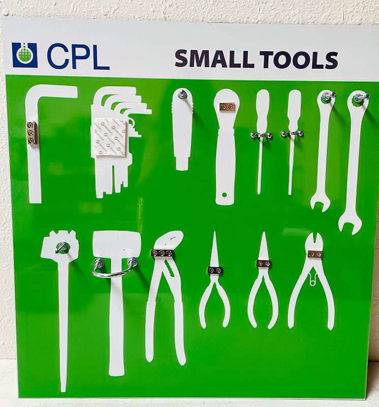CPL Small Tools shadow board on vivid green composite with crisp white tool silhouettes and mechanical mounting clips for hex key sets, ratchets, pliers, and wrenches