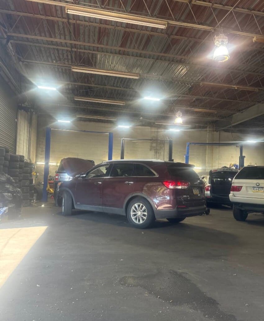 DSJ service bay with vehicle on lift during maintenance