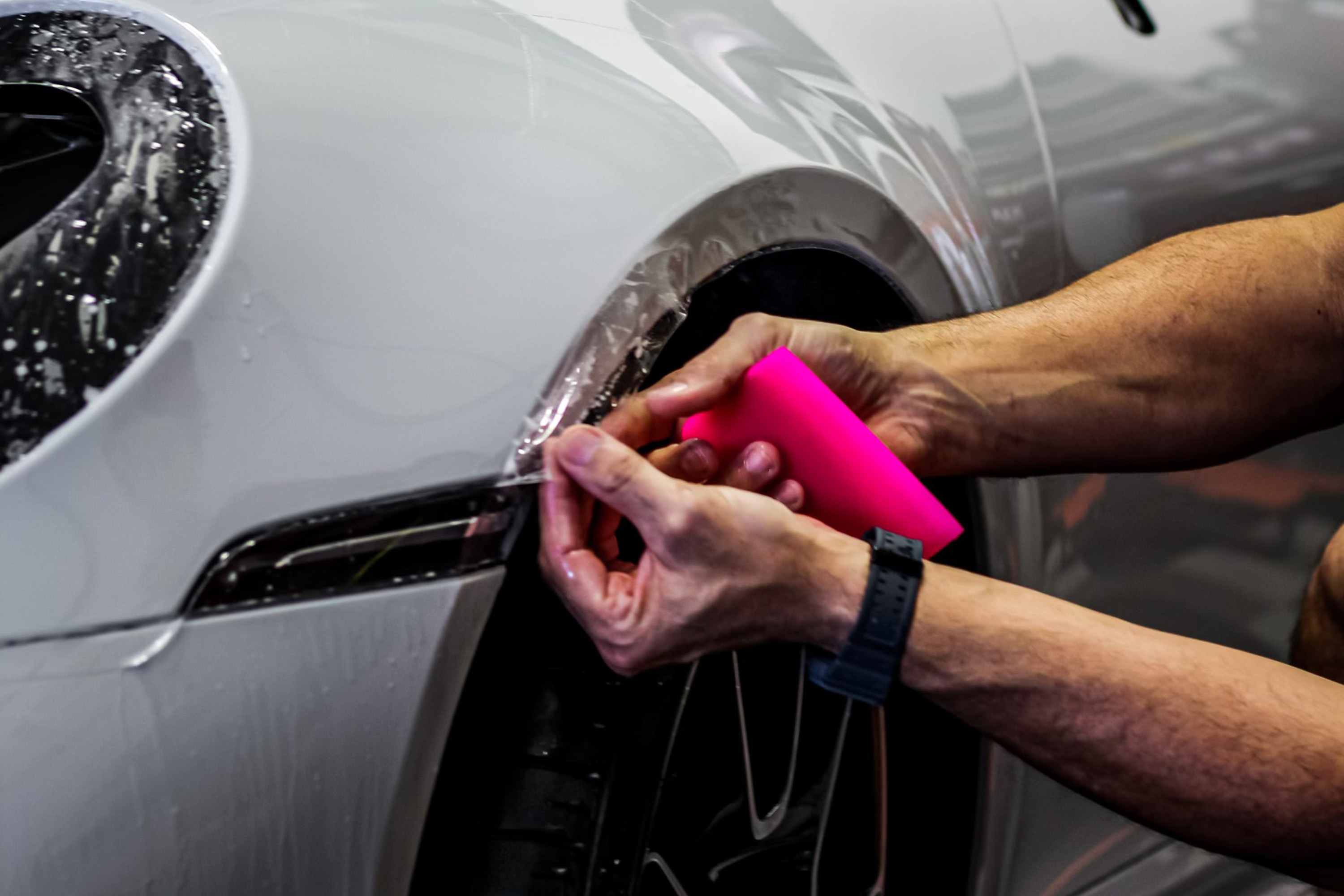 Multi-stage machine paint correction under inspection lighting