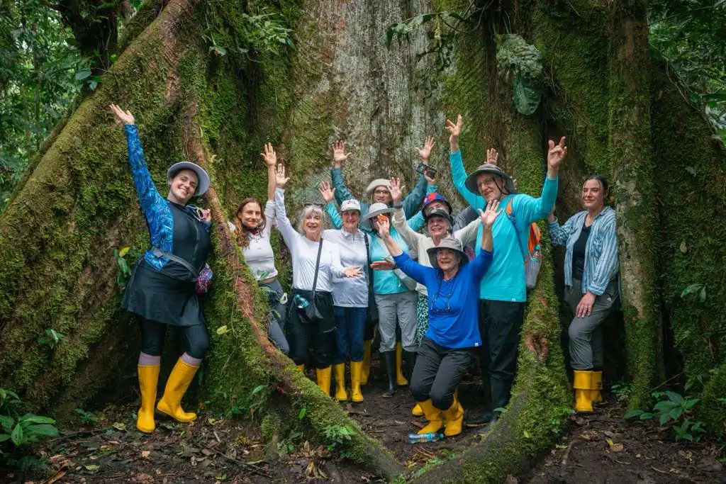 Ecuador Rainforest Yoga Retreat Retreat group by a giant rainforest tree during an Ecuador retreat