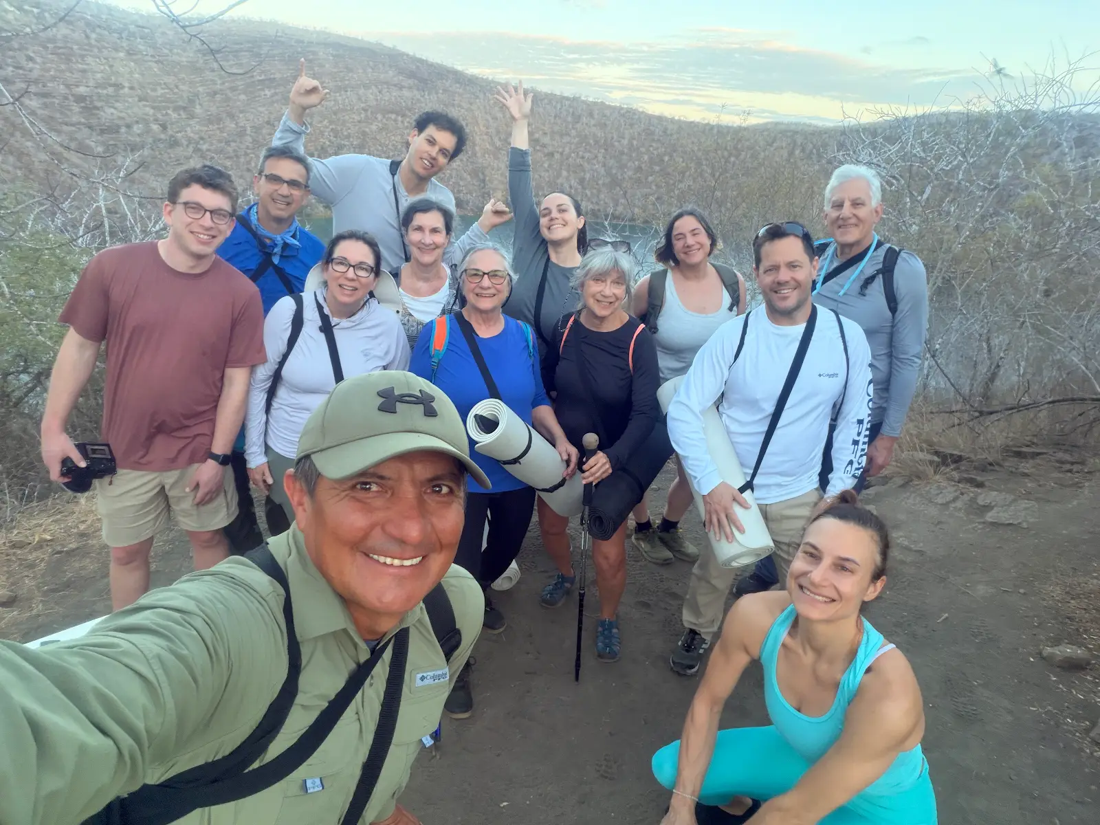Ecuador & Galápagos Mountain Retreat Retreat guests with yoga mats on a scenic mountain overlook during Ecuador and Galápagos retreat