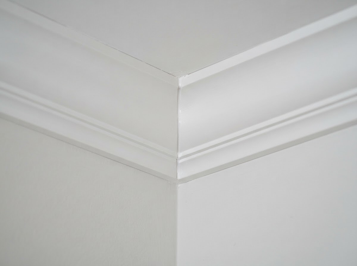 Cope joint detail on crown molding fitted at an out-of-square inside corner