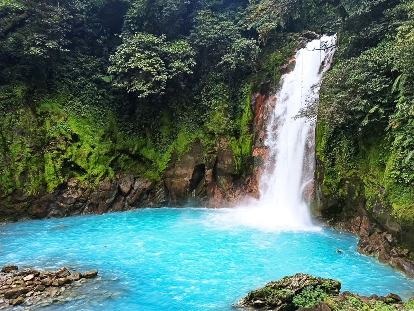 Costa Rica Rio Celeste turquoise waterfall hidden deep in the volcanic rainforest