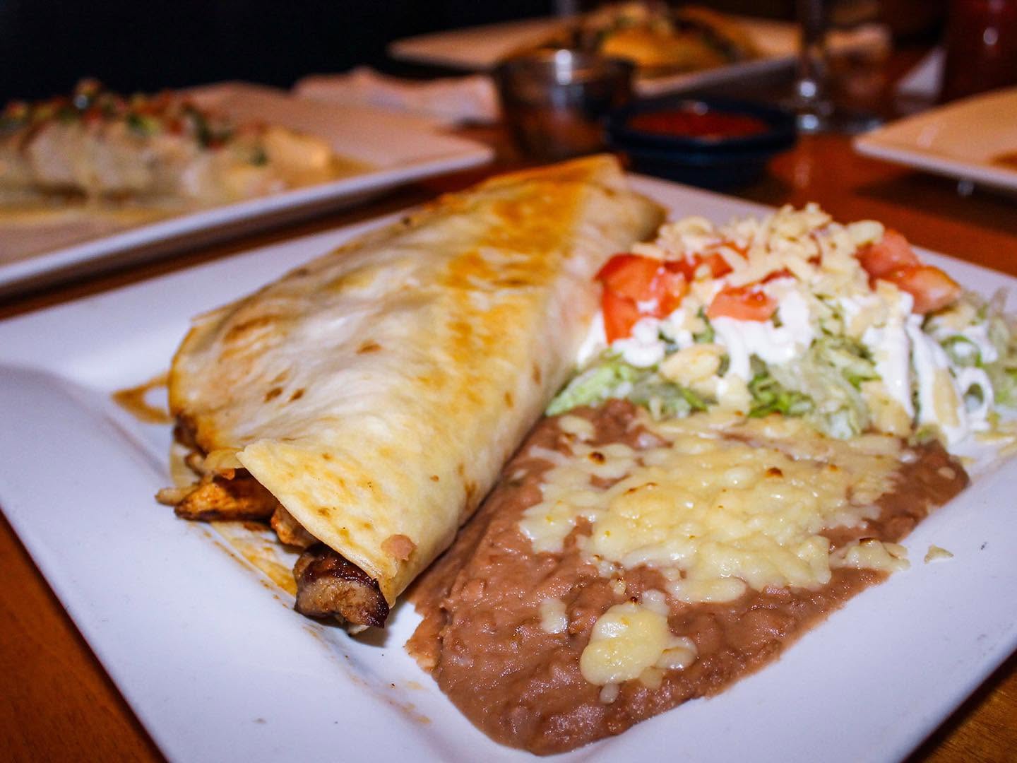 Crisp grilled quesadilla platter served with refried beans and crema salad