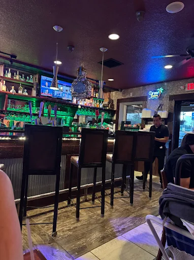 Cozy bar counter and seating area at Casa Grande Mexican Grill in Hicksville, Ohio