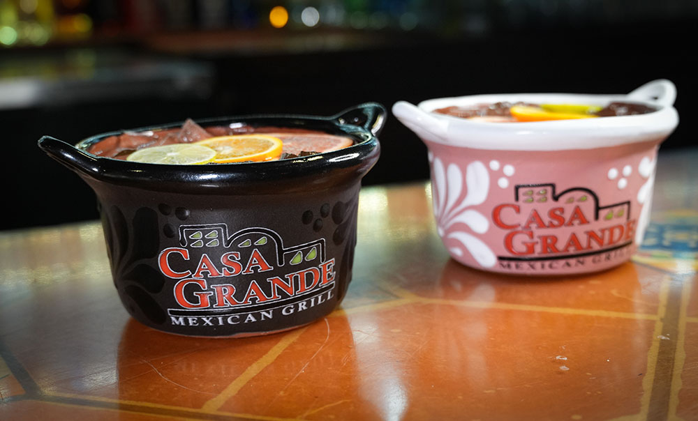 Casa Grande Mexican Grill branded ceramic cantina drink bowls served with fresh lime and orange slices at the Stellhorn bar