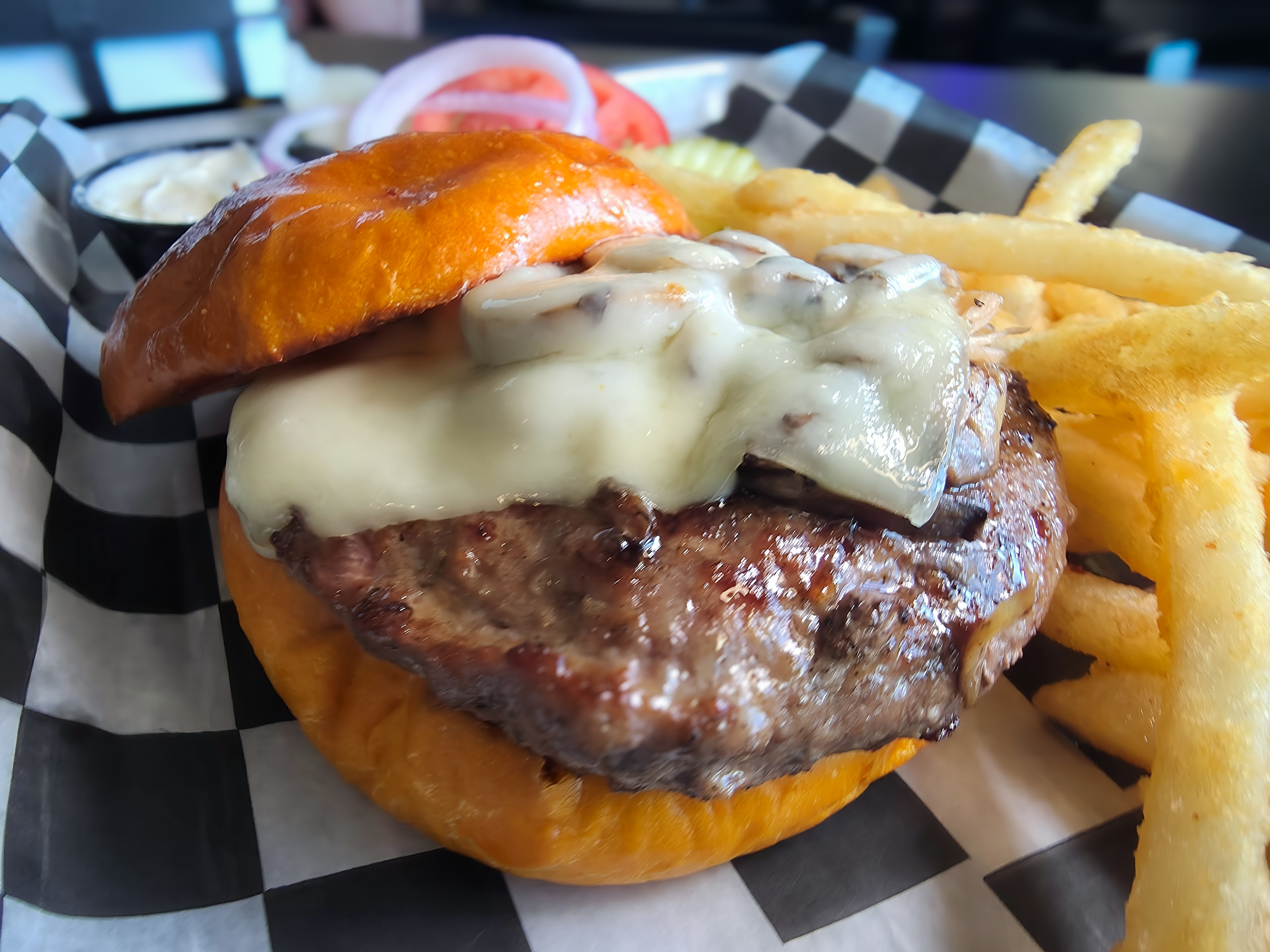Juicy half-pound steak burger topped with melted Swiss cheese and sautéed mushrooms served with fries