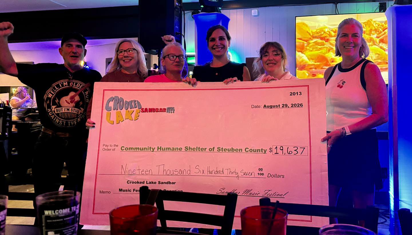 Check presentation party at 4Korners Restaurant presenting $19,637 to Community Humane Shelter of Steuben County