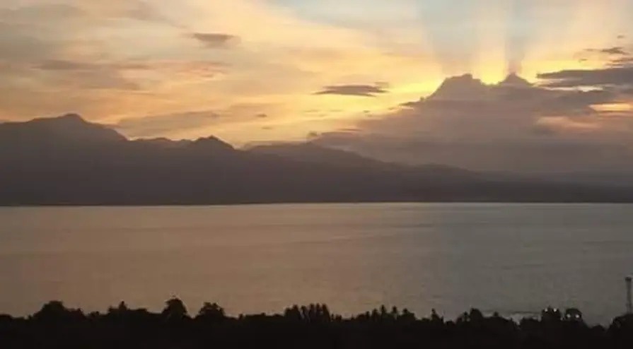 Golden sunset over the mountains and sea horizon in Samboan, Southern Cebu