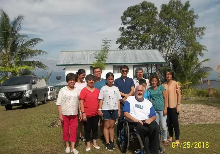 Guests gathered on the sunny front lawn outside Mims House Cebu in Samboan
