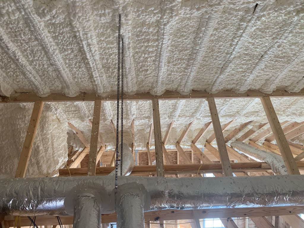 Attic rafters and roofline spray foam with HVAC duct seal in Springfield GA