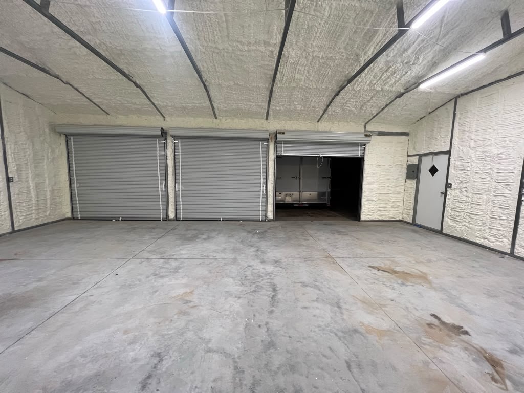 Triple roll-up door commercial workshop with complete spray foam envelope in Aiken SC