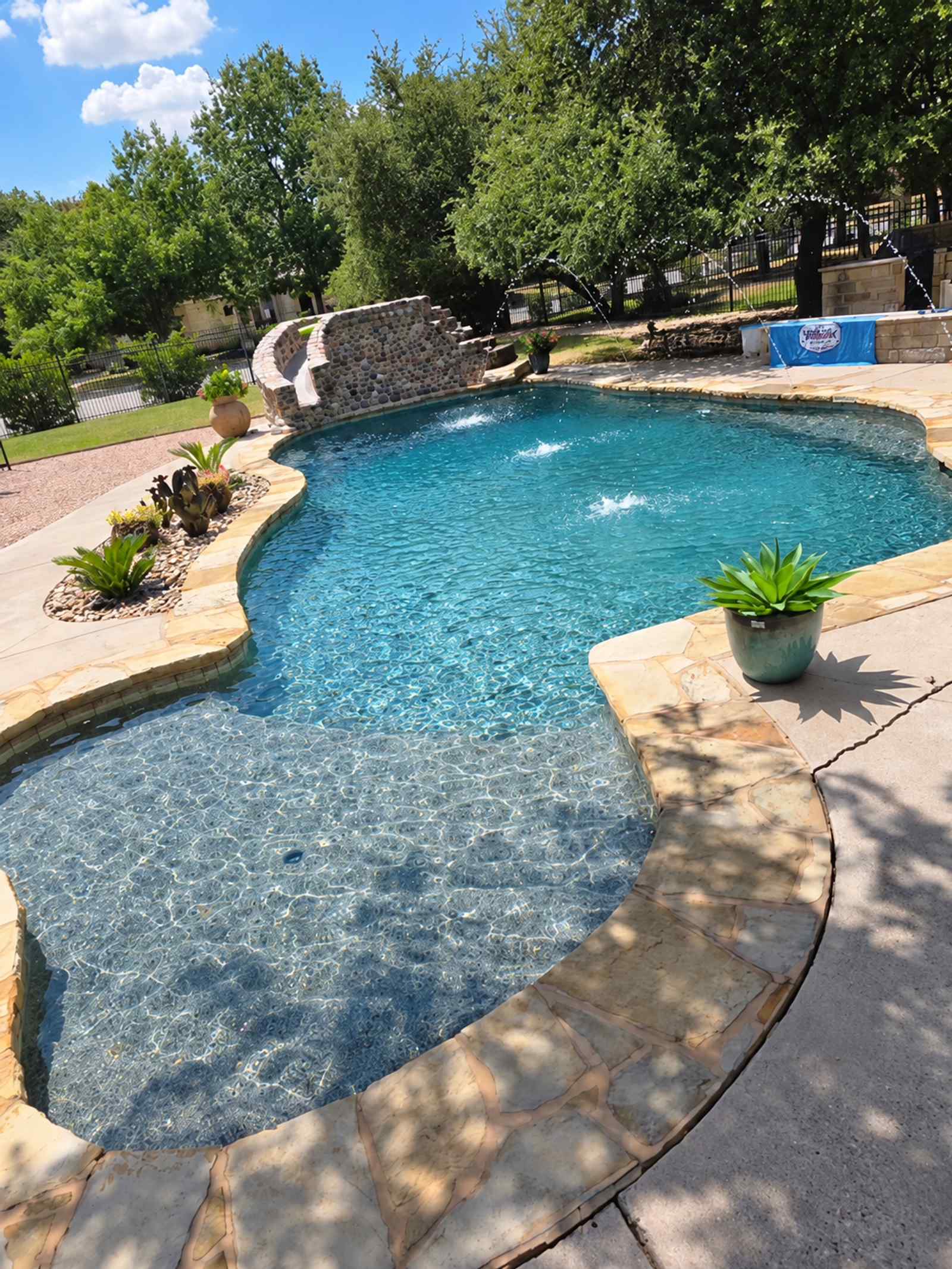 Custom stone water feature and pool maintenance in Central Texas